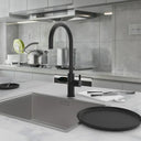 ARNO Flex black instant boiling water tap with digital touch screen in modern kitchen setting