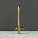 ARNO Halo 6 in 1 boiling water tap brushed gold front view on marble countertop dark background standby mode