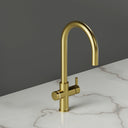 ARNO Halo 6 in 1 boiling water tap brushed gold side view on marble countertop standby mode