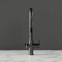 ARNO Halo brushed gunmetal hot water tap front view with pull out spray head extended on marble countertop