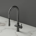 ARNO Halo brushed gunmetal instant boiling water tap rear view with pull out spray head on marble countertop
