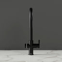 ARNO Halo sparkling water tap matte black front view on marble countertop dark background standby mode