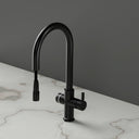 ARNO Halo matt black boiling water tap with pull out spray head rear angle on marble countertop